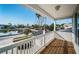 A beautiful covered balcony overlooking a tranquil lake and picturesque neighborhood at 2930 Swan Cir, Dunedin, FL 34698