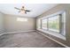 Bedroom featuring neutral walls, plush carpet, and a window seat with natural light at 2930 Swan Cir, Dunedin, FL 34698