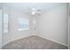 Bedroom with neutral paint, carpet, ceiling fan, and double windows at 2930 Swan Cir, Dunedin, FL 34698