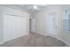 Light-filled bedroom with a closet, ceiling fan, and carpet flooring at 2930 Swan Cir, Dunedin, FL 34698