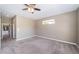 Spacious bedroom features neutral walls, plush carpet and a ceiling fan at 2930 Swan Cir, Dunedin, FL 34698