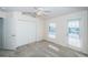Light-filled bedroom with a closet, window and access to a balcony or porch at 2930 Swan Cir, Dunedin, FL 34698