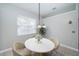 Cozy dining area with elegant table set and views at 2930 Swan Cir, Dunedin, FL 34698
