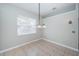 Bright dining area with chandelier and neutral color scheme at 2930 Swan Cir, Dunedin, FL 34698