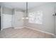 Simple dining area with window and fixture at 2930 Swan Cir, Dunedin, FL 34698