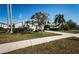 Charming single Gathering home with mature landscaping, long driveway and attached two car garage at 2930 Swan Cir, Dunedin, FL 34698