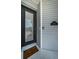 Close-up of front door with glass, decorative hardware, and welcome mat and house number 2930 at 2930 Swan Cir, Dunedin, FL 34698
