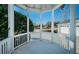 View from inside the gazebo overlooking the front yard, street, and a small pond at 2930 Swan Cir, Dunedin, FL 34698