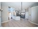 Open-concept kitchen with stainless steel appliances, light-blue cabinets and tile flooring at 2930 Swan Cir, Dunedin, FL 34698
