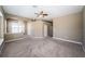 Spacious living room featuring neutral paint and plush carpeting at 2930 Swan Cir, Dunedin, FL 34698