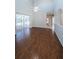 Bright and airy living room with high ceilings and sliding glass doors to the lanai and pool at 2930 Swan Cir, Dunedin, FL 34698