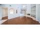Open concept living room with fireplace, vaulted ceilings, and seamless flow to other living spaces at 2930 Swan Cir, Dunedin, FL 34698