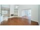 Spacious living room featuring a fireplace, built-in shelves, and access to a screened lanai at 2930 Swan Cir, Dunedin, FL 34698