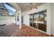 Screened patio with brick pavers, a ceiling fan and seamless indoor/outdoor transition at 2930 Swan Cir, Dunedin, FL 34698