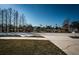 Peaceful view of pond with mature trees from across the street at 2930 Swan Cir, Dunedin, FL 34698
