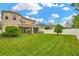 Large backyard with grassy area and privacy fence at 29762 Chapel Chase Dr, Wesley Chapel, FL 33545