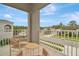 Private balcony with patio furniture and neighborhood view at 29762 Chapel Chase Dr, Wesley Chapel, FL 33545