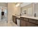 Double vanity bathroom with dark brown cabinets at 29762 Chapel Chase Dr, Wesley Chapel, FL 33545