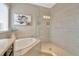 Bathroom with soaking tub and walk-in shower at 29762 Chapel Chase Dr, Wesley Chapel, FL 33545