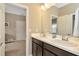 Clean bathroom with double vanity and dark cabinets at 29762 Chapel Chase Dr, Wesley Chapel, FL 33545