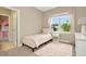Light and airy bedroom featuring a twin bed and window at 29762 Chapel Chase Dr, Wesley Chapel, FL 33545