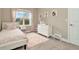 Charming bedroom with a twin bed, dresser, and window at 29762 Chapel Chase Dr, Wesley Chapel, FL 33545