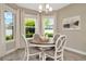 Bright breakfast nook with a round table and four chairs, offering ample natural light at 29762 Chapel Chase Dr, Wesley Chapel, FL 33545