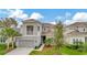 Two-story home with gray exterior and two-car garage at 29762 Chapel Chase Dr, Wesley Chapel, FL 33545