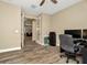 Home office with a desk, chair, and double doors leading to other rooms at 29762 Chapel Chase Dr, Wesley Chapel, FL 33545