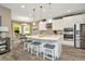 Modern kitchen with white cabinets, stainless steel appliances, and a large island at 29762 Chapel Chase Dr, Wesley Chapel, FL 33545
