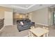 Spacious loft area with gray couch and a small table and chairs at 29762 Chapel Chase Dr, Wesley Chapel, FL 33545