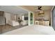 Outdoor kitchen and lounge area with sliding glass doors at 29762 Chapel Chase Dr, Wesley Chapel, FL 33545