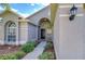 Inviting home exterior with a walkway leading to the front door at 31342 Philmar Ln, Wesley Chapel, FL 33543