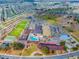 Aerial view of community with clubhouse, pool, and parking at 317 Green Manor Dr # 38 B, Sun City Center, FL 33573
