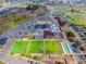 Aerial view of community amenities including clubhouse, pool, and sports fields at 317 Green Manor Dr # 38 B, Sun City Center, FL 33573