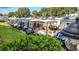 Row of golf carts parked neatly in community lot at 317 Green Manor Dr # 38 B, Sun City Center, FL 33573