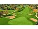 Aerial view of a lush green golf course with sand traps and water features at 317 Green Manor Dr # 38 B, Sun City Center, FL 33573