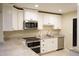 Modern kitchen with white cabinets, granite countertops, and stainless steel appliances at 317 Green Manor Dr # 38 B, Sun City Center, FL 33573