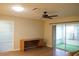 Living room with wood-look floors, ceiling fan, and access to patio at 317 Green Manor Dr # 38 B, Sun City Center, FL 33573