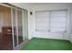 Cozy patio accessible from the living room, with green artificial turf at 317 Green Manor Dr # 38 B, Sun City Center, FL 33573