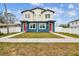 Two story duplex home with neutral siding and red front doors at 3467 17Th S Ave, St Petersburg, FL 33701