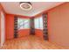 Bright bedroom with hardwood floors and a cork accent wall at 3628 Holiday Lake Dr, Holiday, FL 34691