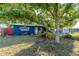 Quaint front yard with mature shade tree at 3628 Holiday Lake Dr, Holiday, FL 34691