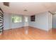 Living room with hardwood floors, an accent wall, and natural light at 3628 Holiday Lake Dr, Holiday, FL 34691