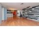 Bright living room with hardwood floors and modern wall decor at 3628 Holiday Lake Dr, Holiday, FL 34691