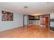 Spacious living area featuring hardwood floors and an artistic wall at 3628 Holiday Lake Dr, Holiday, FL 34691