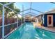 Enclosed pool area with spa and patio at 3628 Holiday Lake Dr, Holiday, FL 34691