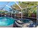Inviting pool and hot tub in screened enclosure at 3628 Holiday Lake Dr, Holiday, FL 34691