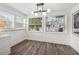 Bright dining room with hardwood floors, large windows, and neutral-colored walls at 3731 6Th N Ave, St Petersburg, FL 33713