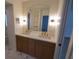 Bathroom featuring double vanity, marble countertop, and gold fixtures at 414 S Shore Crest Dr, Tampa, FL 33609
